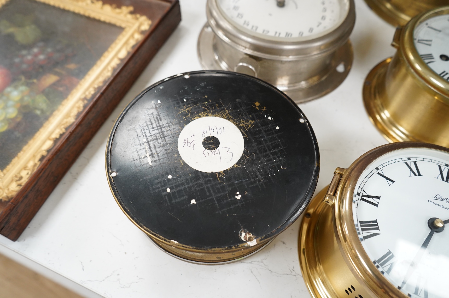 A ship's clock by Story of Barrow, a CCCP ship's clock and four other brass examples, some with keys, largest 28cm in diameter
